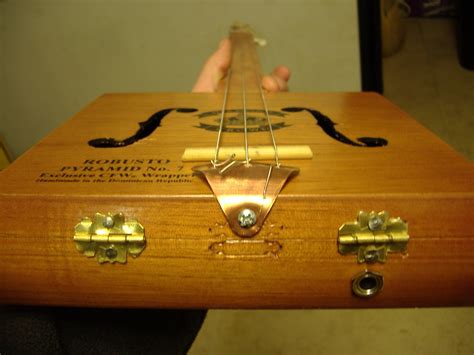 how to make a cigar box style electric guitar|one string cigar box guitar.